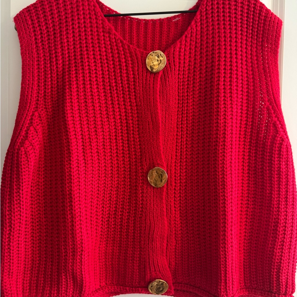 Red sweater vest with gold buttons